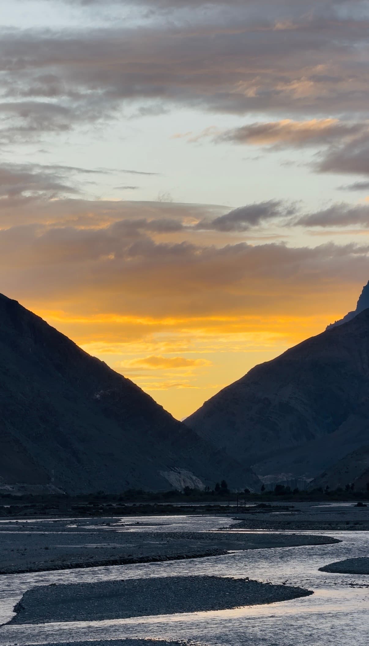 Sunset over the river valley near Kaza